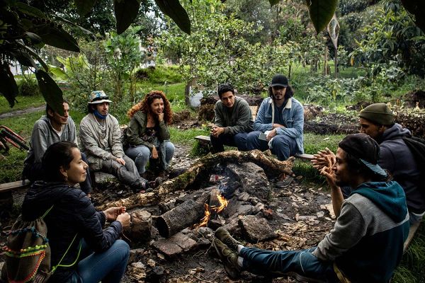 Group of People Sitting in Front of Campfire - Bogotá, Colombia. Photo by Daniel Camargo on Pexels